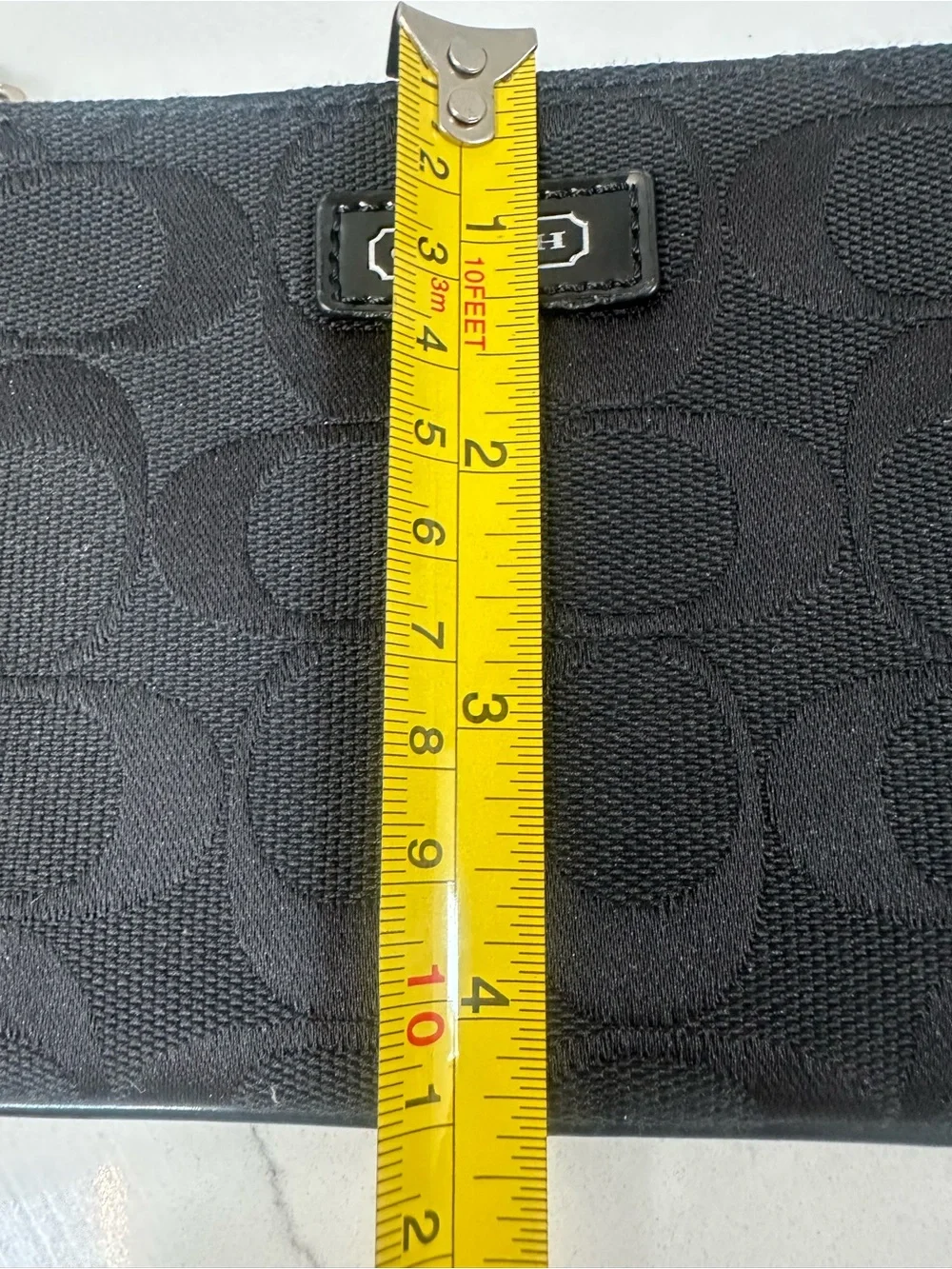 COACH Black Signature Wristlet with white coach tag